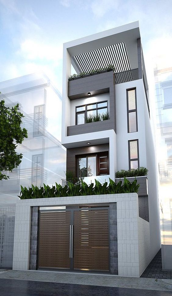 Tông màu trắng chủ đạo mang đến sự sang trọng cho ngoại thất ngôi nhà phố 3 tầng mặt tiền 4m.